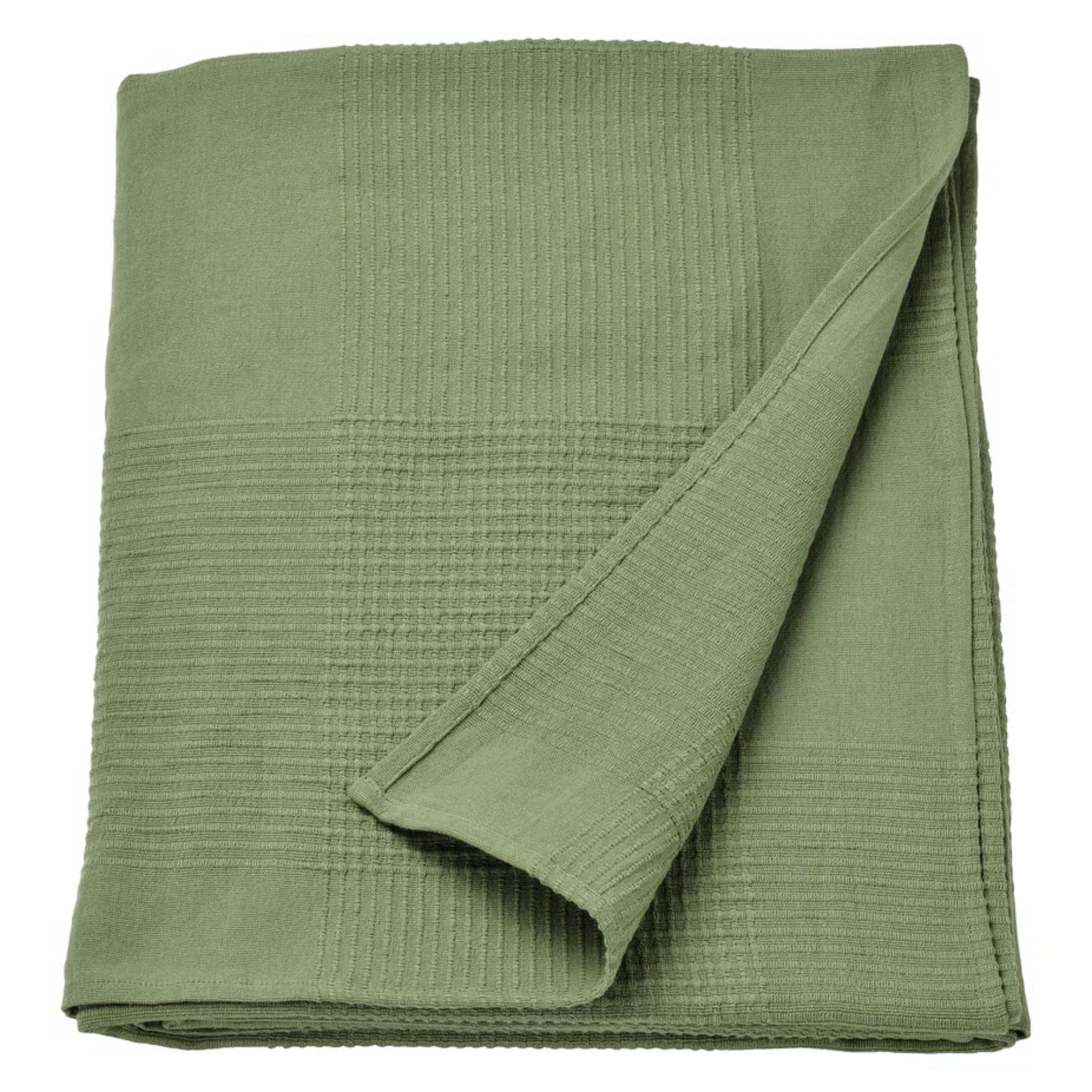 Folded dark green IKEA bed blanket