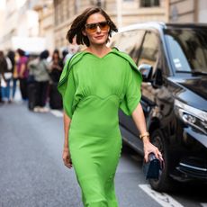 olivia palermo wears a green dress during paris fashion week
