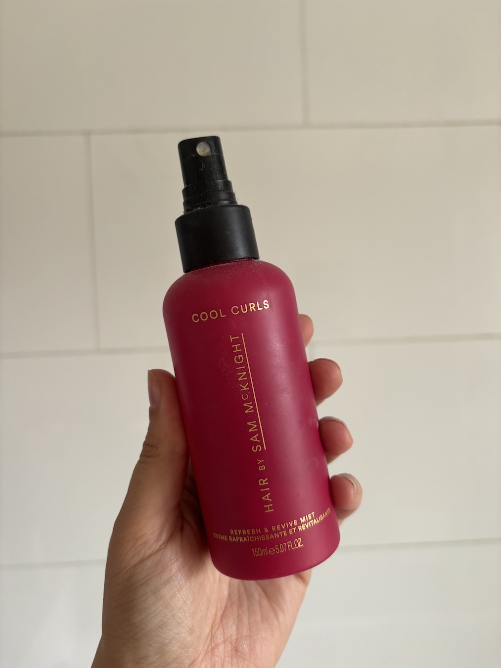 Mica Ricketts holding Hair by Sam McKnight Cool Curls Refresh &amp;amp; Revive Mist