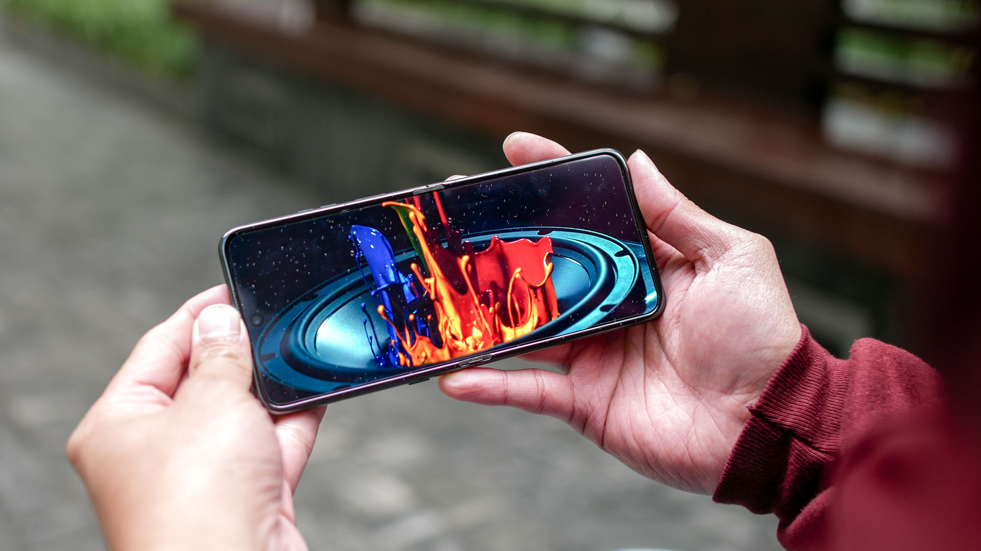 Motorola Razr Ultra 2025 playing a video outdoors.