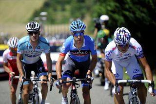 The leading men (L to R): France's Samuel Dumoulin, Belgium's Dries Devenyns, Belgium's Christian Vande Velde and France's Pierrick Fedrigo ride in a breakaway past fields of sunflowers