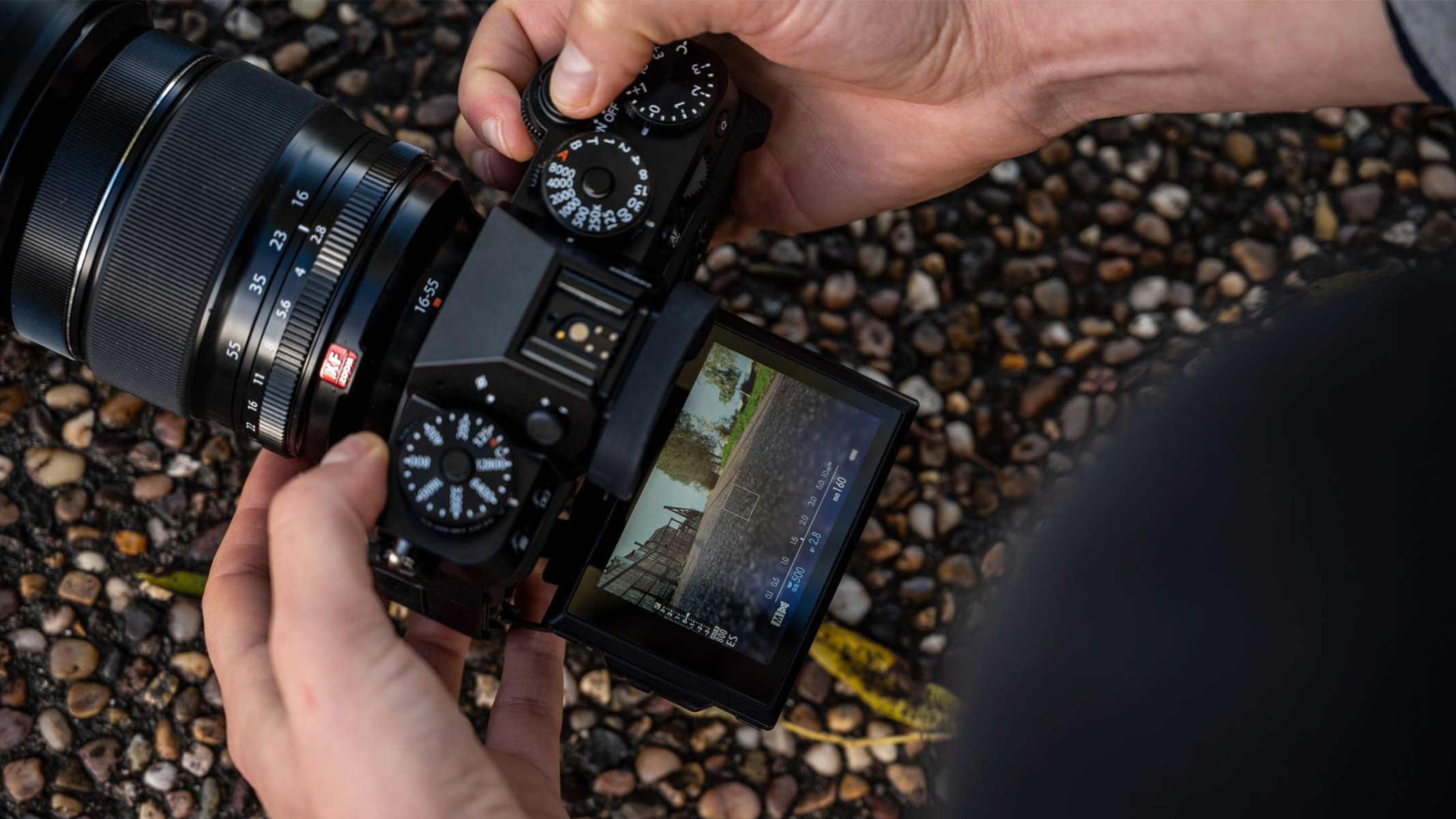 Top down view of the camera held at a low angle with the rear screen tilted out