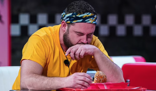 I'm a Celebrity contestant Danny Miller eating an unpleasant burger