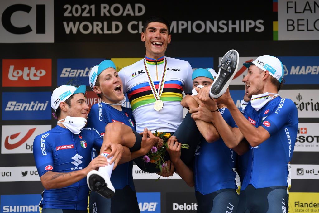 LEUVEN BELGIUM SEPTEMBER 24 UCI Nations Cup U23 First classified Team Italy with Filippo Baroncini of Italy Luca Coati of Italy Luca Colnaghi of Italy Marco Frigo of Italy Michele Gazzoli of Italy and Filippo Zana of Italy pose on the podium after the 94th UCI Road World Championships 2021 Men U23 Road Race a 1609km race from Antwerp to Leuven flanders2021 on September 24 2021 in Leuven Belgium Photo by Tim de WaeleGetty Images