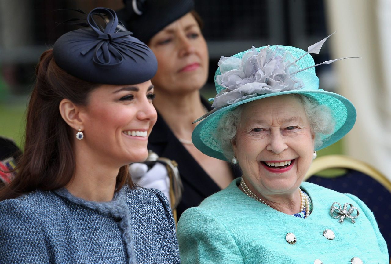 Catherine, Duchess of Cambridge and Queen Elizabeth II smile as they visit Vernon Park