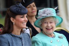Catherine, Duchess of Cambridge and Queen Elizabeth II smile as they visit Vernon Park