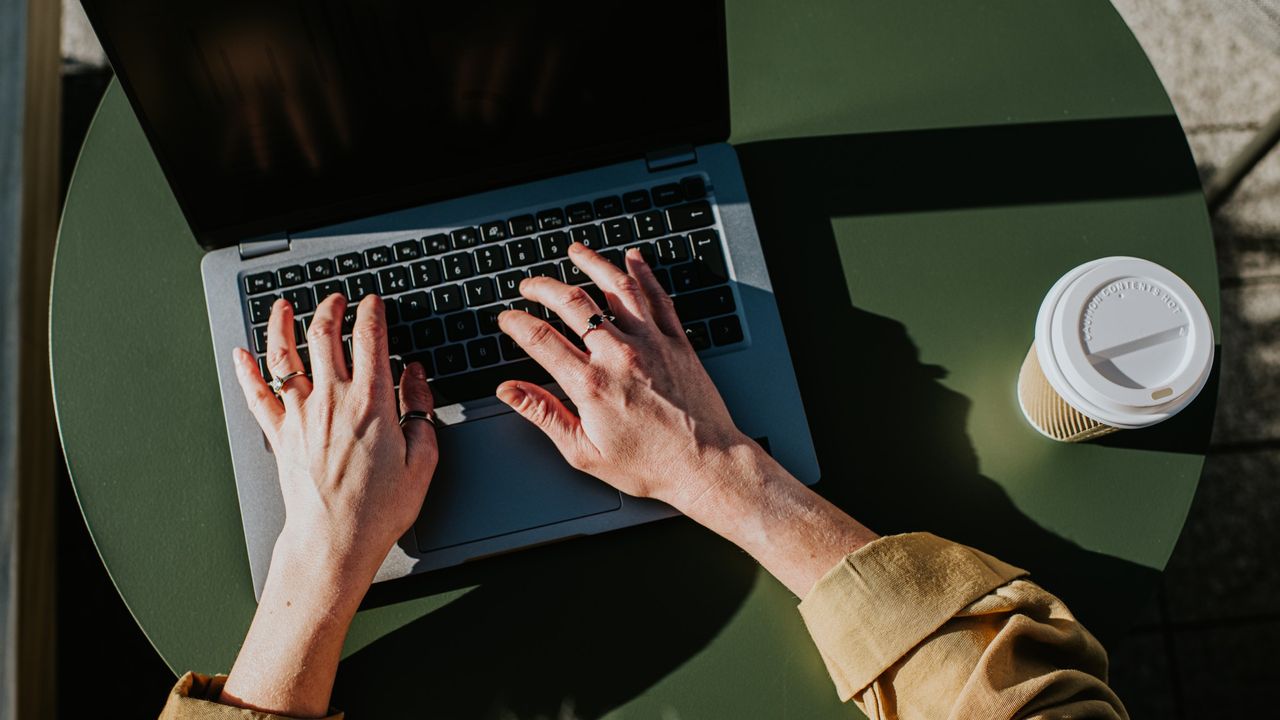 Person typing on laptop