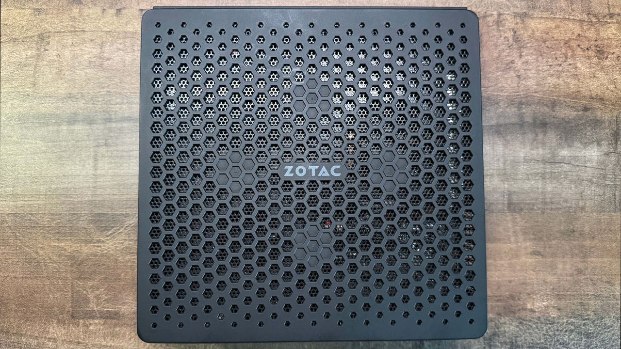 Zotac Zbox Magnus EN374070C mini PC on a wooden background