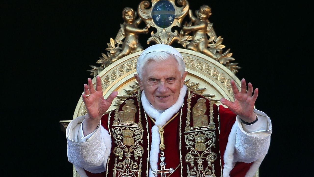 VATICAN CITY, VATICAN - DECEMBER 25:Pope Benedict XVI waves to the faithfuls as he delivers his Christmas Day message &amp;#039;urbi et orbi&amp;#039; blessing (to the city and to the world) from the central b