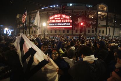 Chicago Cubs fans celebrate the World Series win outside Wrigley Field
