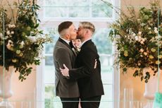 a couple from Married at First sight sharing a kiss at the altar
