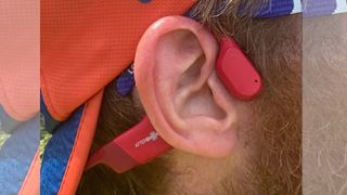 Fit&Well's tester Howard Calvert wears the AfterShokz Aeropex headphones on a run