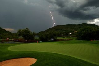 Lightning bolt over golf course GettyImages-83923218
