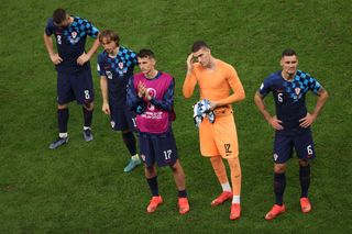 Mateo Kovacic, Luka Modric, Ante Budimir, Ivo Grbic and Dejan Lovren of Croatia look dejected following their sides defeat after the FIFA World Cup Qatar 2022 semi final match between Argentina and Croatia at Lusail Stadium on December 13, 2022 in Lusail City, Qatar.