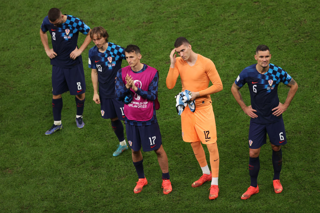 Mateo Kovacic, Luka Modric, Ante Budimir, Ivo Grbic and Dejan Lovren of Croatia look dejected after their side's defeat after the Qatar 2022 FIFA World Cup semi-final between Argentina and Croatia at Lusail Stadium on December 13, 2022 in Lusail City, Qatar.