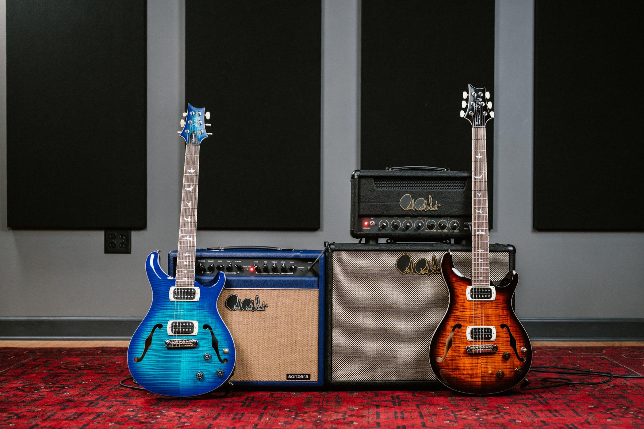 PRS SE Hollowbody I Piezo and SE Ed Sheeran Hollowbody I Piezo Baritone with SE amps in limited edition Indigo and Black Paisley coverings
