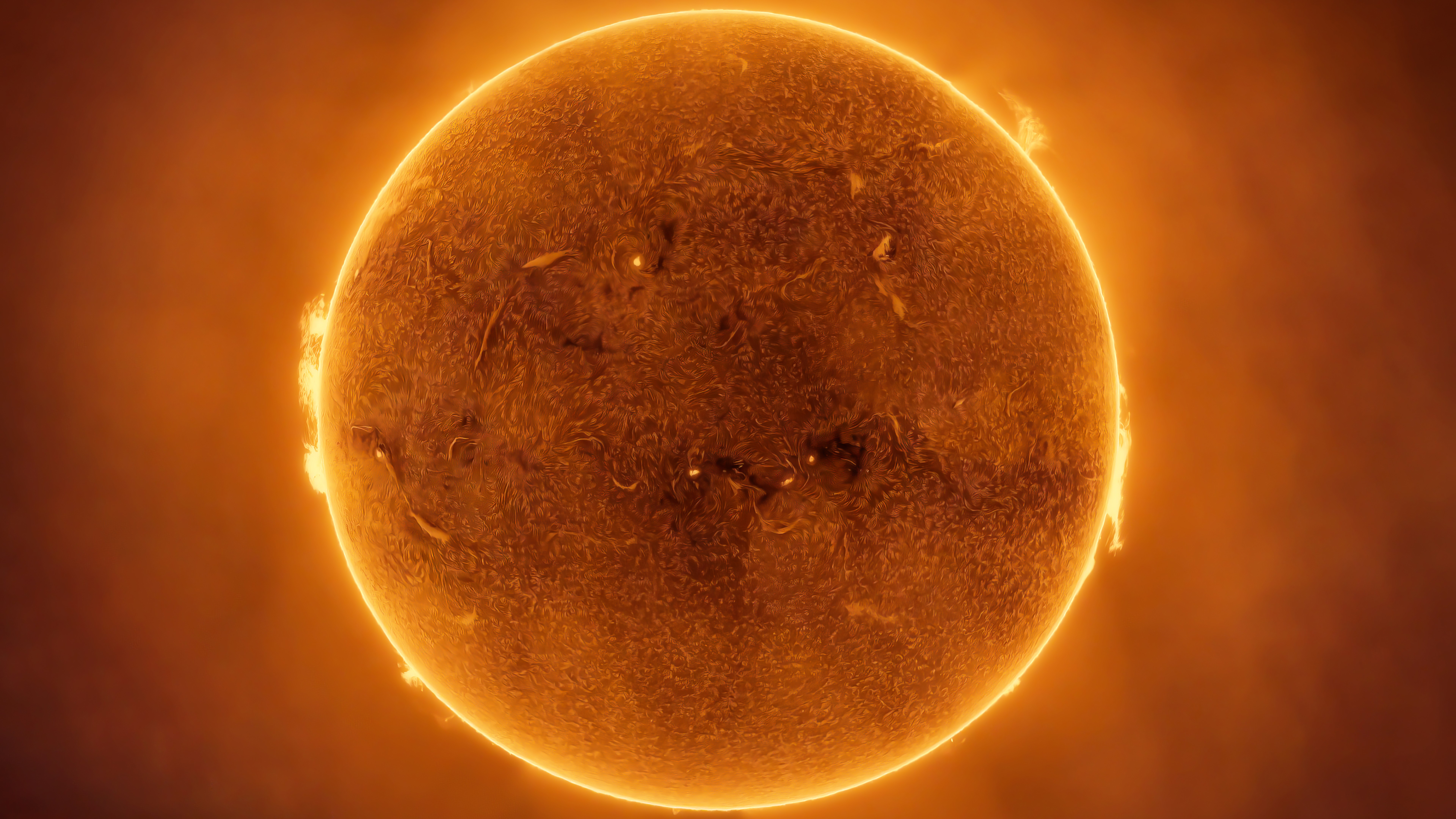 close up view of the sun shows a detailed solar surface crackling with activity.