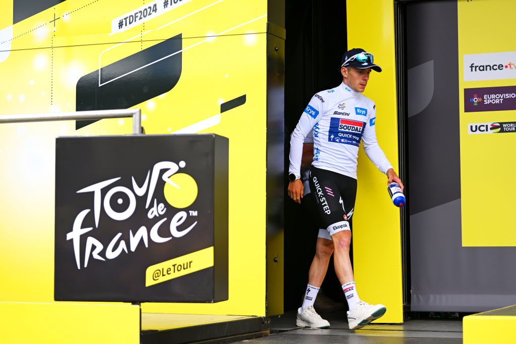 PAU FRANCE JULY 12 Remco Evenepoel of Belgium and Team Soudal QuickStep White Best Young Rider Jersey celebrates at podium during the 111th Tour de France 2024 Stage 13 a 1653km stage from Agen to Pau UCIWT on July 12 2024 in Pau France Photo by Dario BelingheriGetty Images
