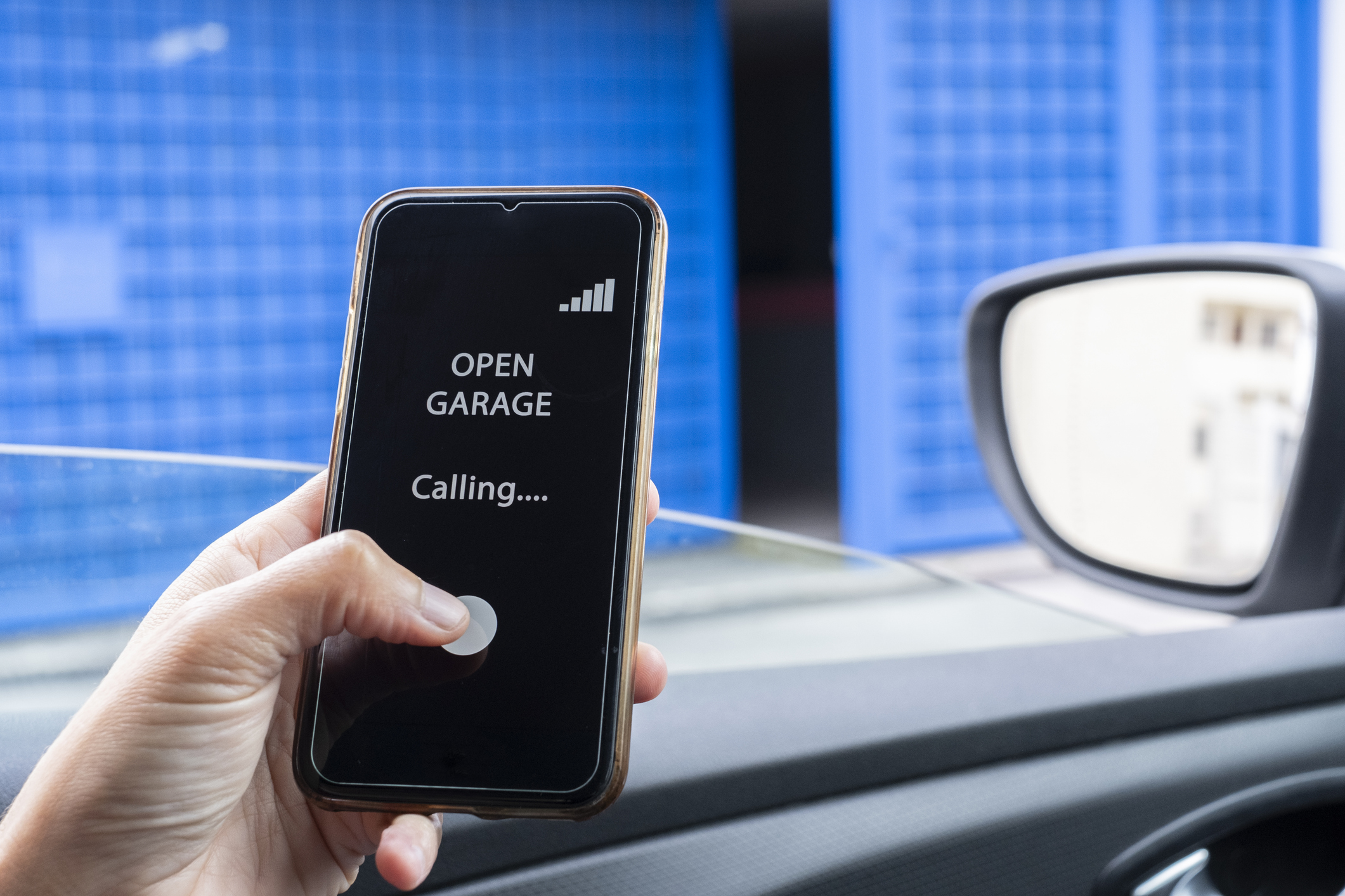 A smartphone opening a garage door.