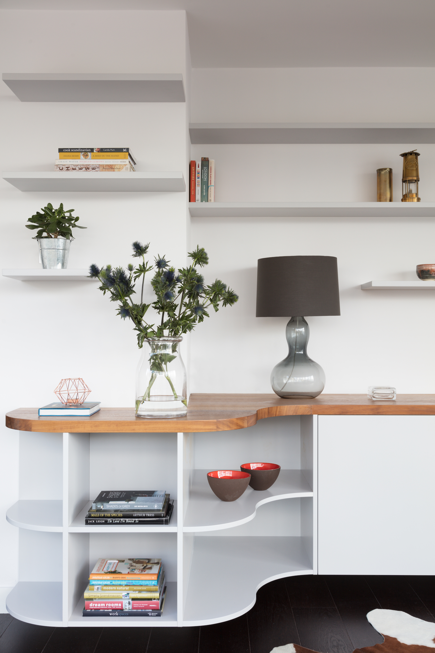 Bespoke storage in an all white living room