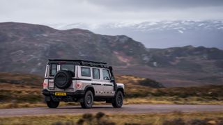 Ineos Grenadier driving through Scottish highlands
