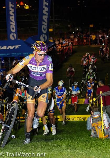 Ryan Trebon (Kona) running a hill in first place.