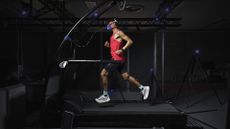 Athlete running on a treadmill in full Adidas gear