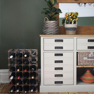 dining room with chest of drawers and wine rack