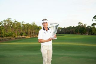 Langer holds the Chubb Classic trophy