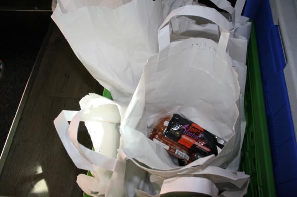 Each rider has his own white paper lunch bag