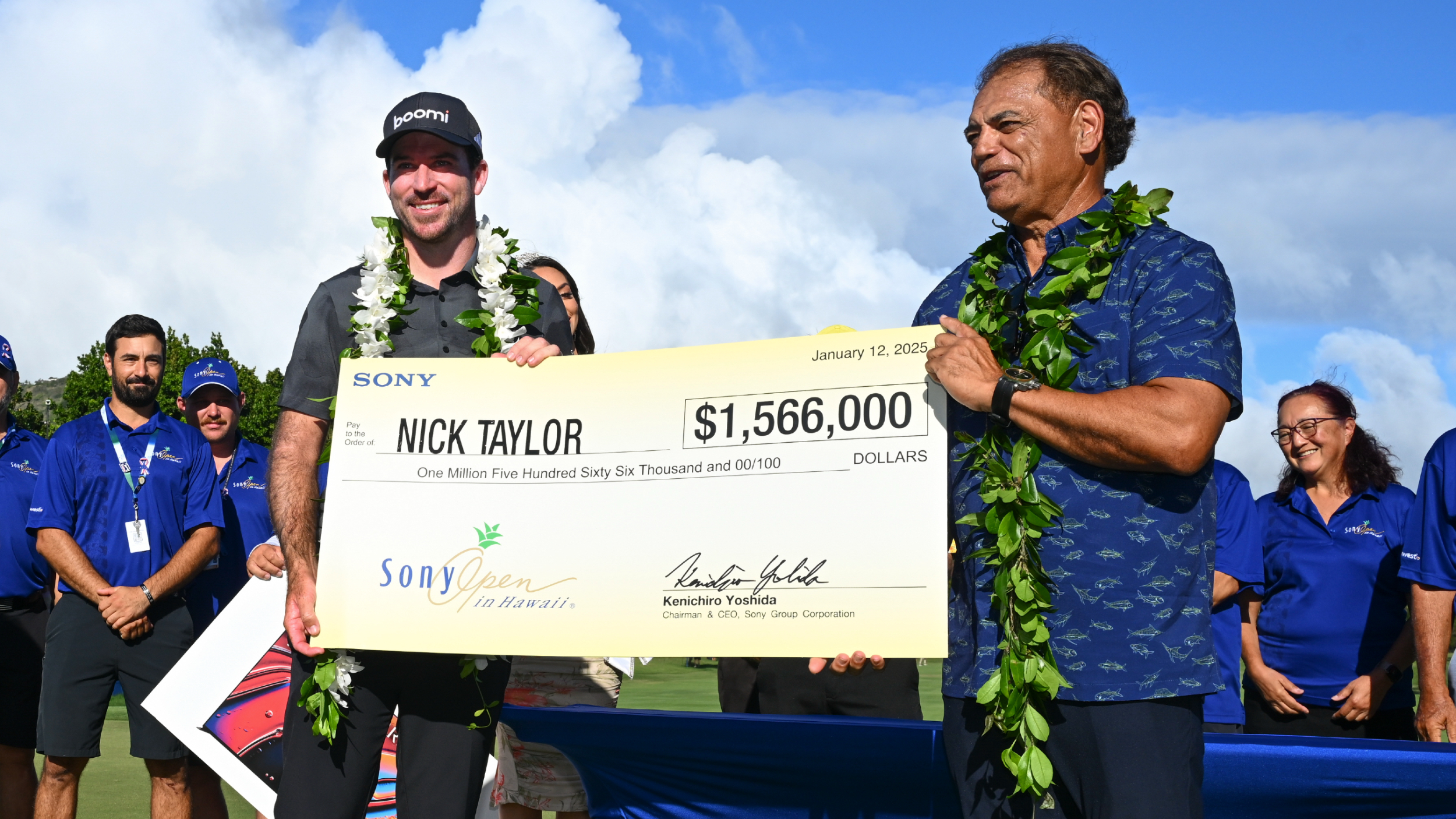 Nick Taylor with his cheque after winning the Sony Open in Hawaii