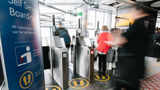 Passengers using face ID security gates at an airport