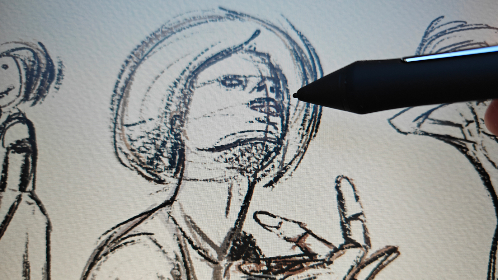 A black drawing tablet on a desk