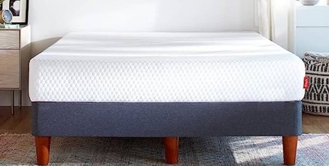 Layla The Essential Mattress review image shows the white mattress on a grey divan bed base