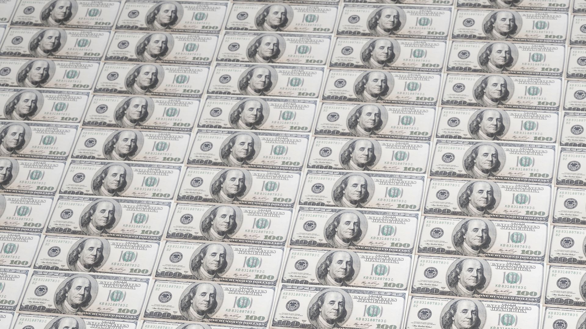 Hundred-dollar bills laid end to end and top to bottom.
