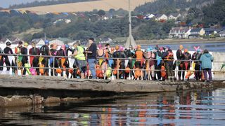 swimmers line up at start of kessock ferry swim