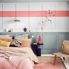 Pink and white bedroom with shelf ledge