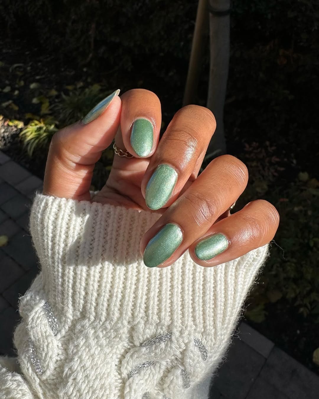 Sage metallic nails.