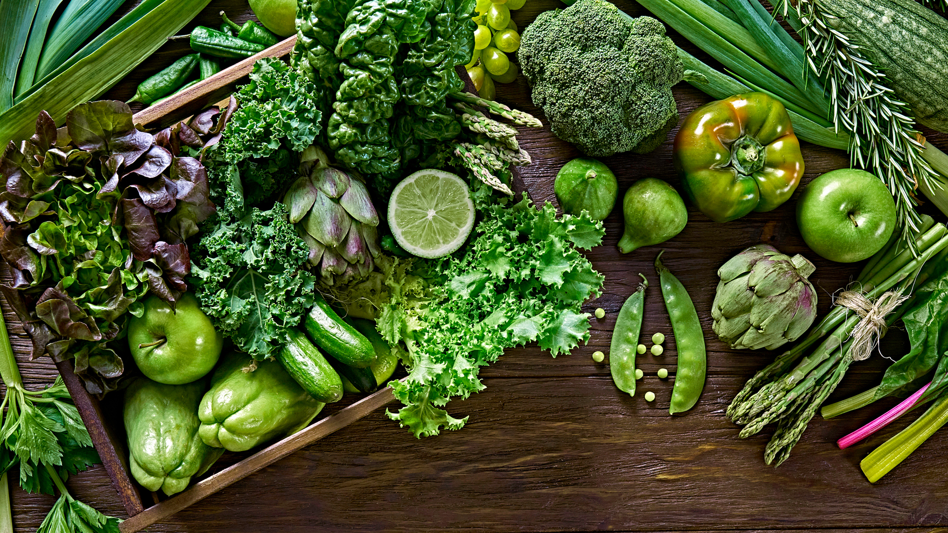 Top view background of variation of green vegetables for detox and alkaline diet
