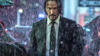 Keanu Reeves as John Wick, walking through a rainy street, in John Wick: Chapter 3 - Parabellum