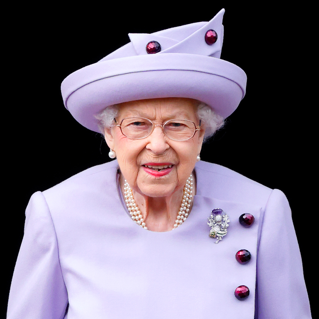 Queen Elizabeth wears a lilac dress and matching hat