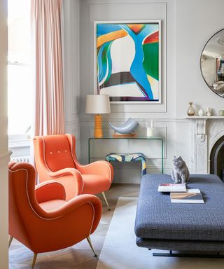 Living room with orange chairs and low furniture