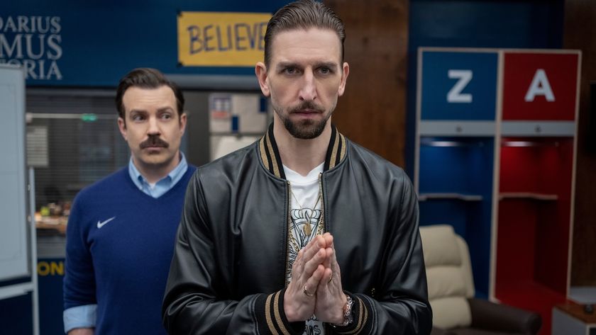 Zava making prayer hands in the AFC Richmond locker room while Ted Lasso stands behind him