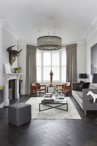 white living room with grey sofa