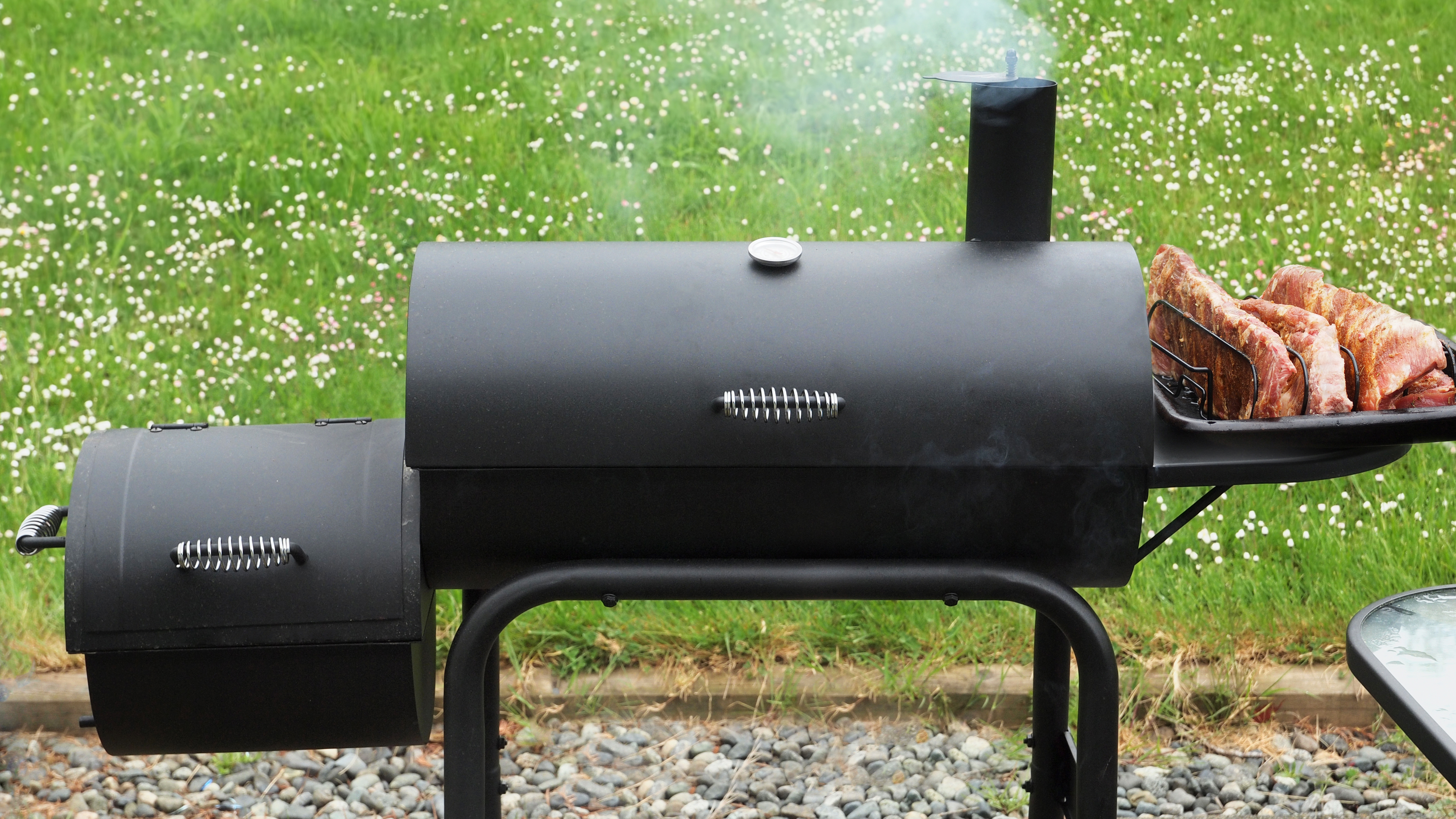 What are offset smokers, and how do they work?