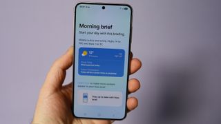 Samsung Galaxy S25 in hand, Now Brief app