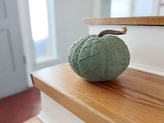 green painted sweater pumpkin