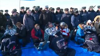 NASA astronaut Christina Koch, cosmonaut Alexander Skvortsov of Roscosmos and European Space Agency (ESA) astronaut Luca Parmitano rest in chairs after landing from the International Space Station on the steppe of Kazakhstan on Feb. 6, 2020.