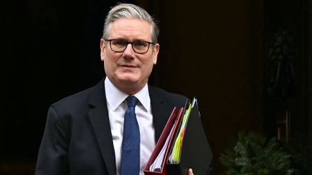 TOPSHOT - Britain's Prime Minister Keir Starmer leaves 10 Downing Street in central London on December 10, 2025, to take part in the weekly session of Prime Minister's Questions (PMQs). (Photo by Ben STANSALL / AFP via Getty Images)