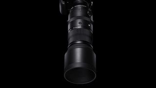 The Sigma 150-600mm F5-6.3 DG DN OS Sports super-telephoto lens on a black background